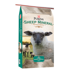 Purina Sheep Mineral. White feed bag. White sheep.