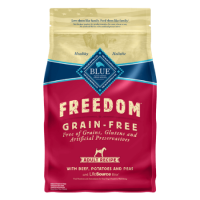 Blue Buffalo Blue Freedom Grain-Free Beef Recipe For Adult Dogs. Tan, blue and red dry dog food bag. 