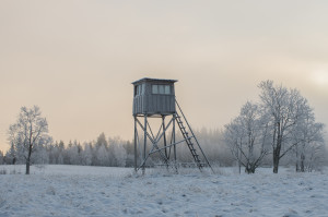 Hunting tower in harsh winter in the Lithuanian field